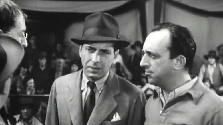 Bogart and a man speak