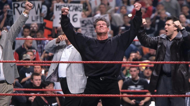 Vince standing in the ring victorious 