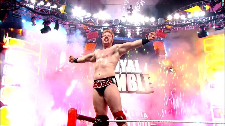 Sheamus with fireworks behind him