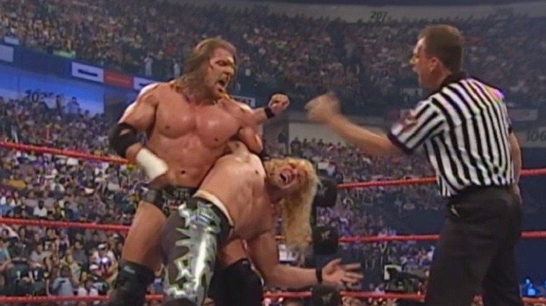 Triple H stretching Chris Jericho