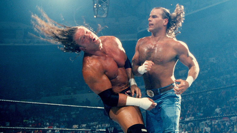 Shawn Michaels punching Triple H