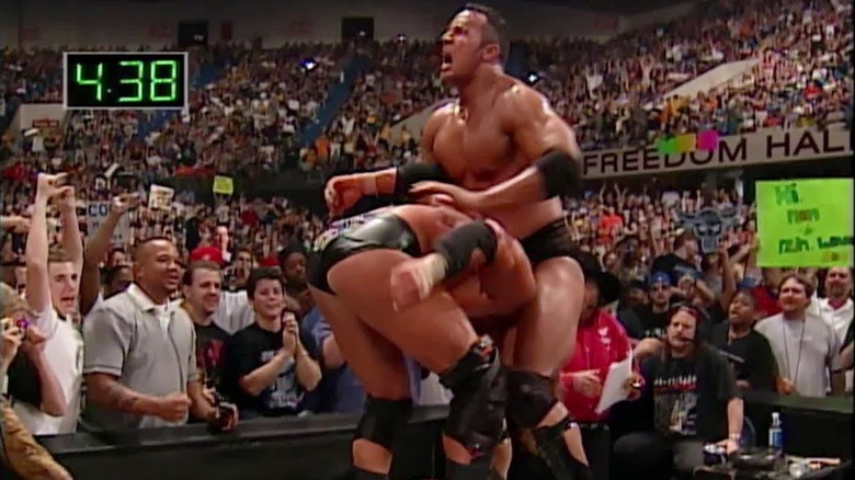 The Rock about to hit the Pedigree on Triple H