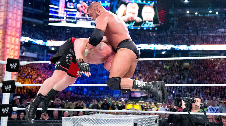 Triple H hits the pedigree on an opponent during an episode of "WWE SmackDown."