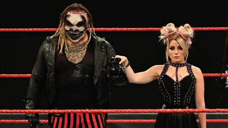 The Fiend and Alexa Bliss holding hands