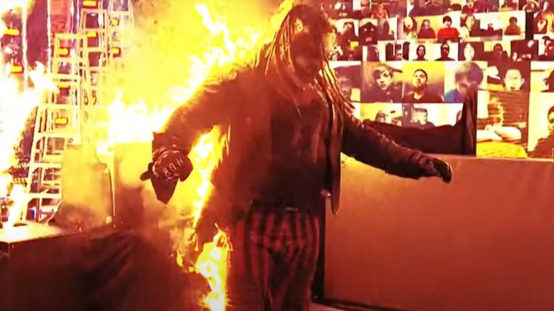 The Fiend stands aflame after being pushed into fire surrounding the ring by Randy Orton.