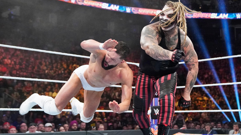 The Fiend takes down Finn Balor in the middle of the ring during their match at SummerSlam in 2019.