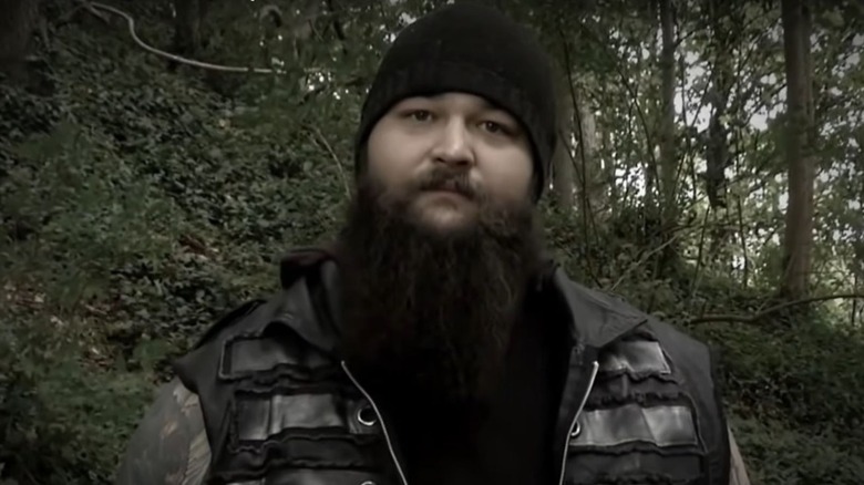 Bray Wyatt tells a ghost story about a man in the woods to the camera for a video on WWE's YouTube channel.