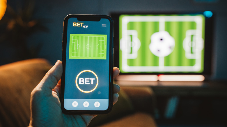 Phone with soccer betting app