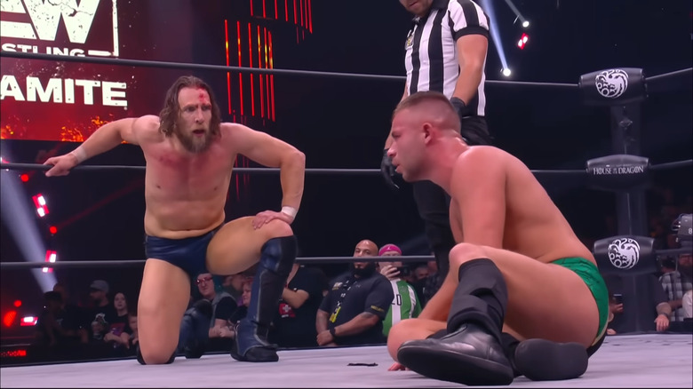 Bryan Danielson Daniel Garcia crouching