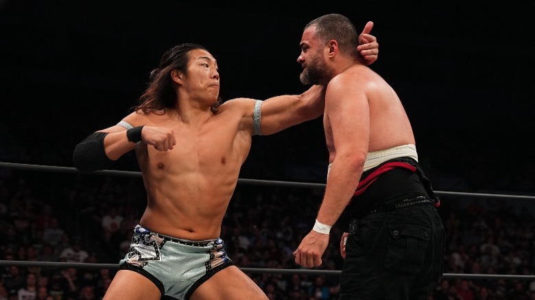 Konosuke Takeshita punching Eddie Kingston