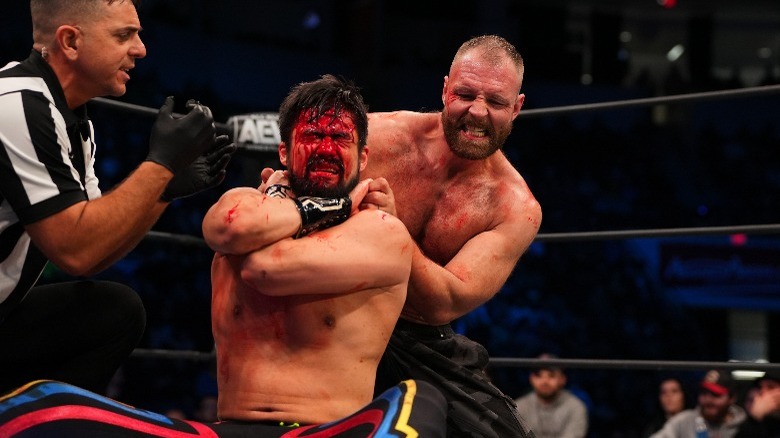 Jon Moxley choking Wheeler Yuta