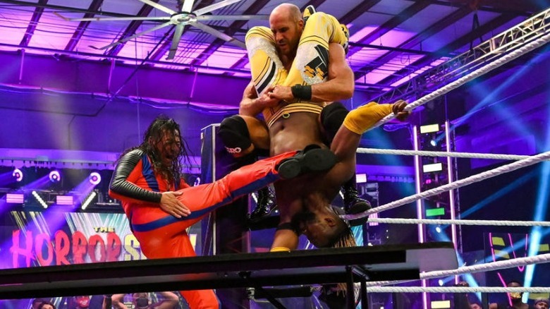 Cesaro and Shinsuke Nakamura attack Kofi Kingston