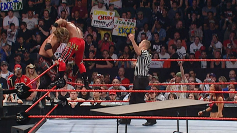 Benoit holds Edge on top rope