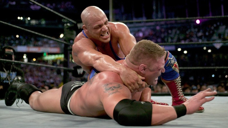 Kurt Angle chinlocks Brock Lesnar