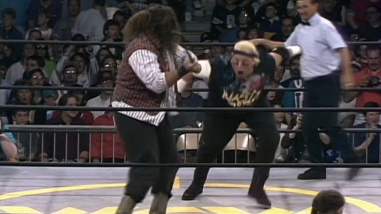 Cactus Jack attacking Brian Knobbs