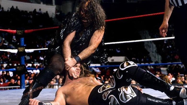Mankind pulling Shawn Michaels up