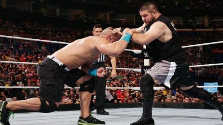 Kevin Owens attacking John Cena