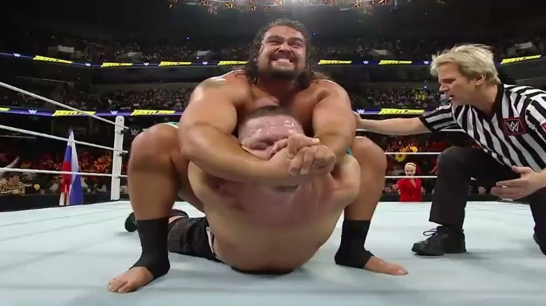 Rusev with John Cena in the Accolade