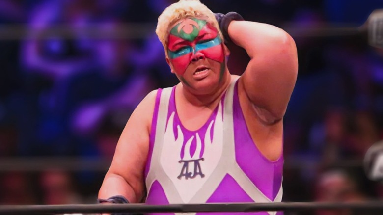 Aja Kong looks to the crowd during a match in the AEW ring.