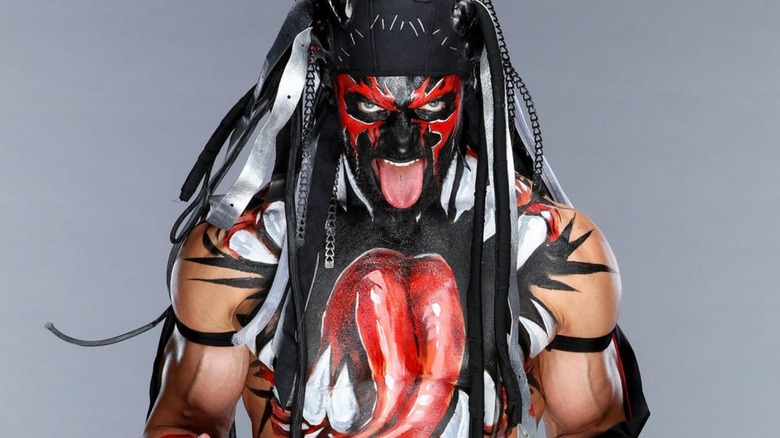 Finn Balor poses as his "demon" persona. 