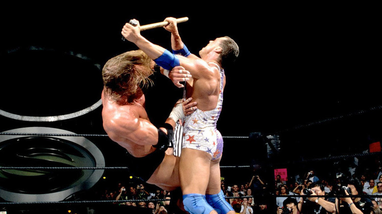 Kurt Angle hits Triple H With sledgehammer