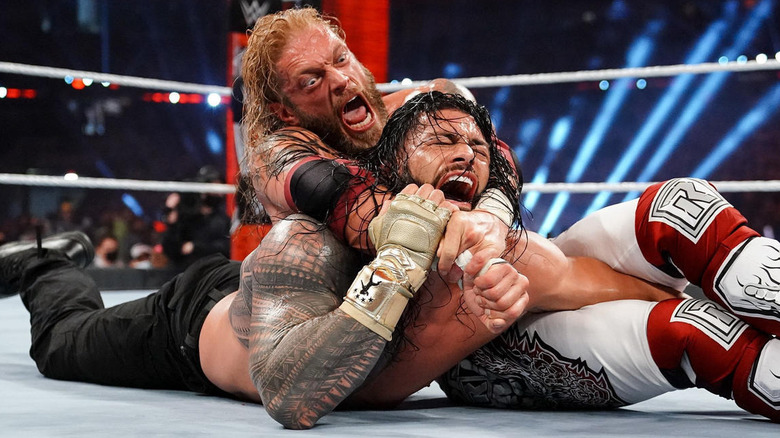 Edge With Roman Reigns In Submission Hold 