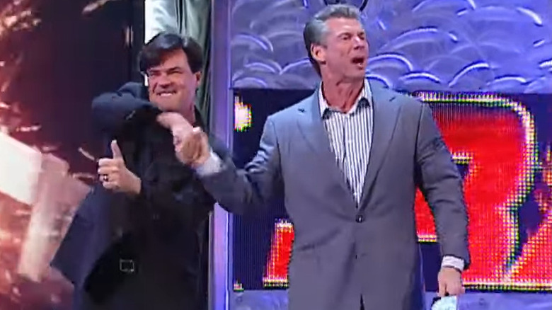 Vince McMahon and Eric Bischoff shake hands