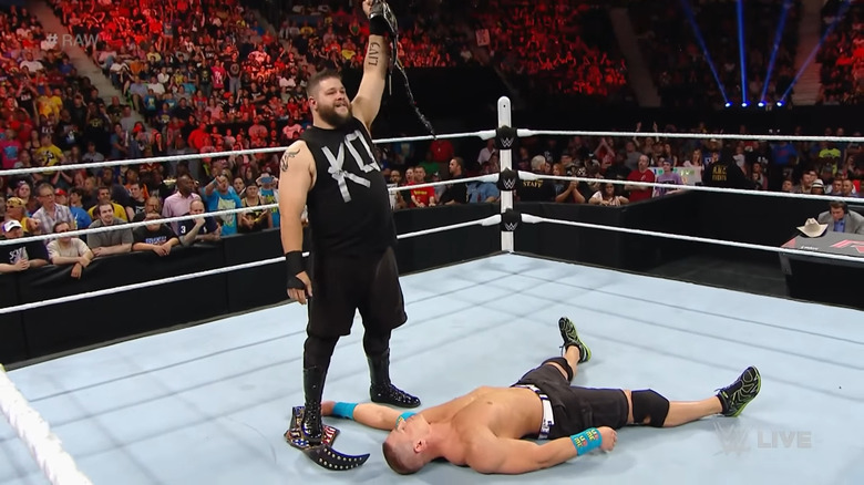 Kevin Owens stands on John Cena