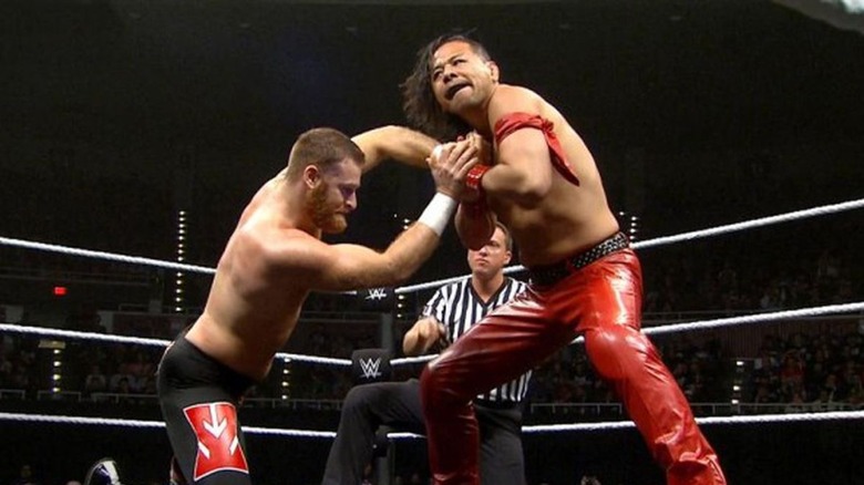 Shinsuke Nakamura and Sami Zayn wrestling 