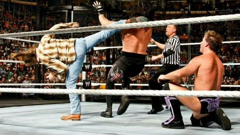 Shawn Michaels kicking the Undertaker