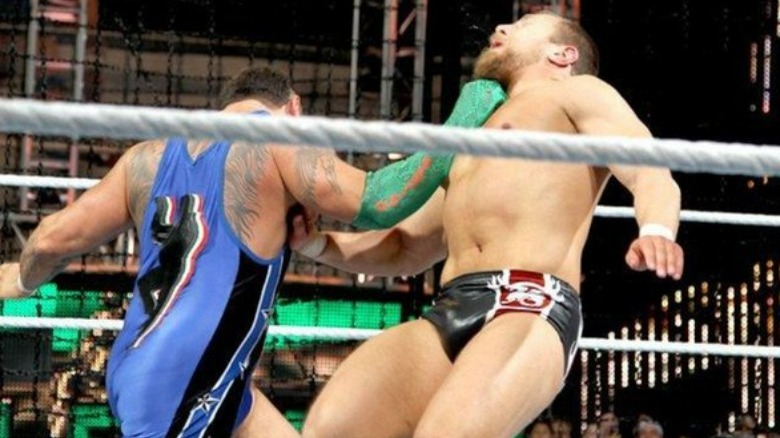 Santino Marella hitting Daniel Bryan with the Cobra