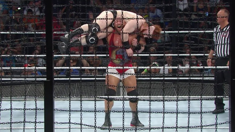 Ryback lifting Sheamus in a fireman's carry