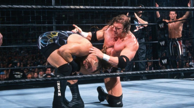 Triple H hitting RVD with a knee