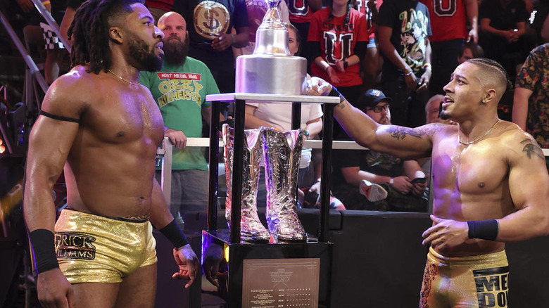 Trick Williams and Carmelo Hayes looking at the Dusty Cup