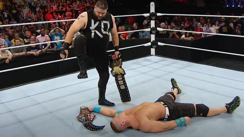 Former "WWE NXT" Champion Kevin Owens goes to stomp on the United States Championship as John Cena lays in the ring.