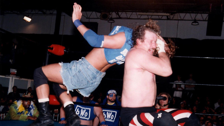 Terry Funk delivers a neckbreaker to Stevie Richards