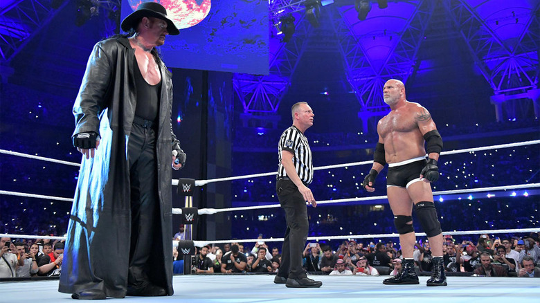 Undertaker and Goldberg stare down