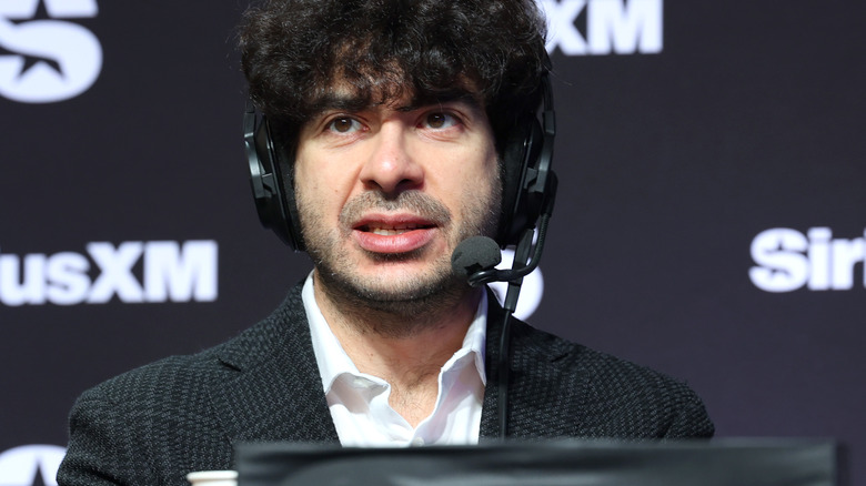 Tony Khan wearing a headphone mic