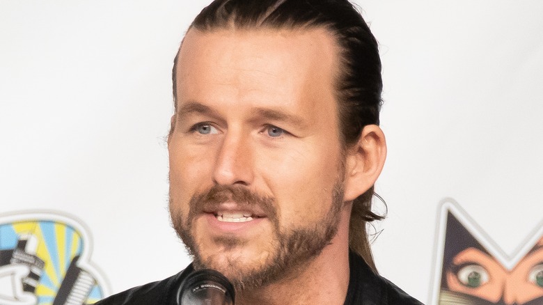 Adam Cole at the microphone 