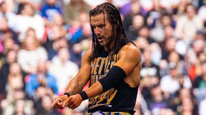 Adam Cole pointing down the way