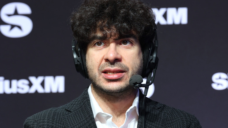 Tony Khan wearing a headset