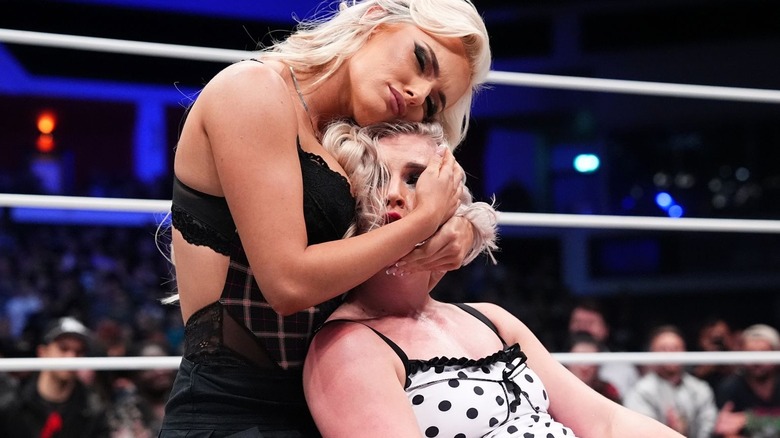 Mariah May cradling Toni Storm