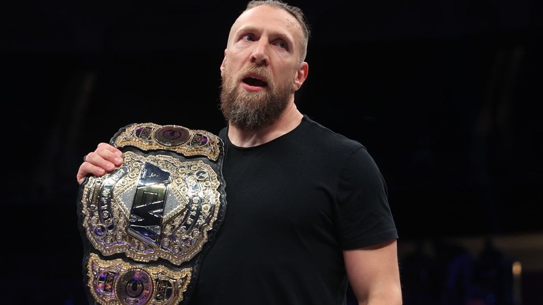 Bryan Danielson holding world title belt