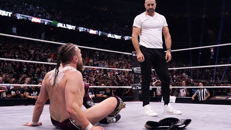 Claudio Castagnoli looks down on Bryan Danielson