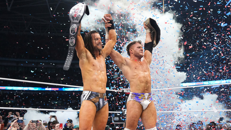 Adam Cole and MJF celebrate with the ROH Titles