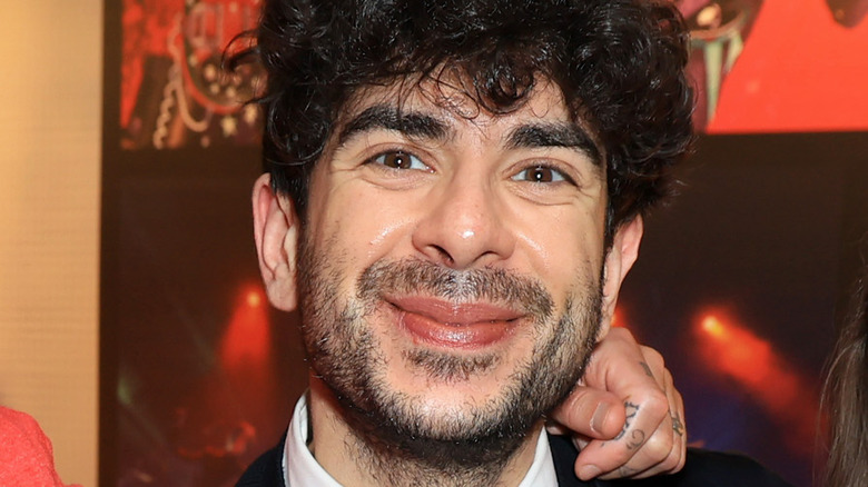 AEW President Tony Khan smiling