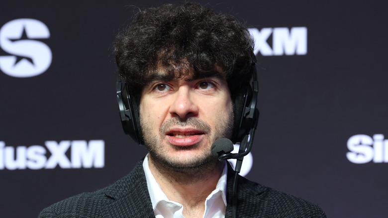 Tony Khan wearing a headset