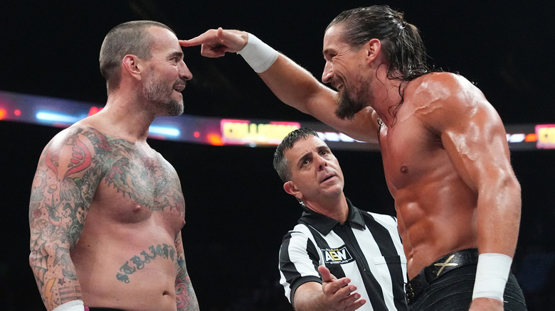 Jay White holds up a finger to CM Punk's forehead