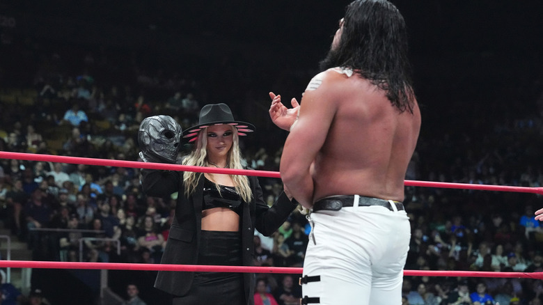 Julia Hart shows Andrade El Idolo his mask