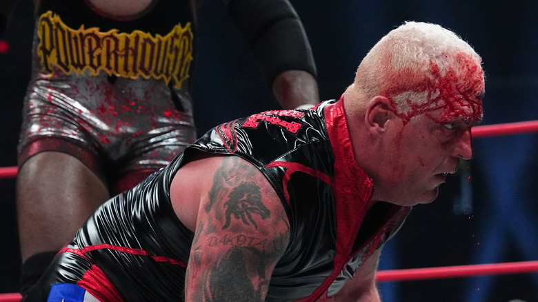 Dustin Rhodes bleeding in front of Powerhouse Hobbs